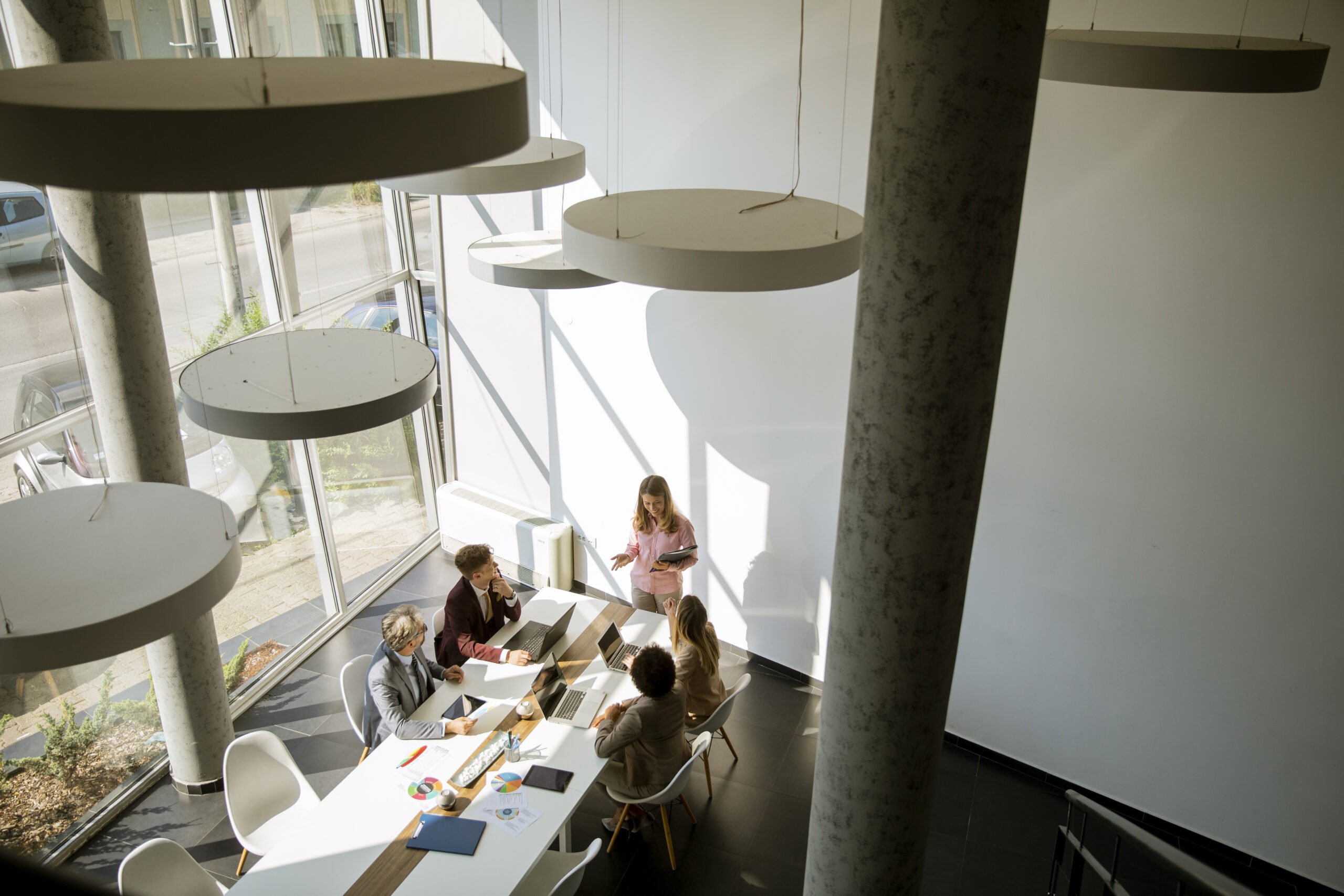 Overhead view at group of multiethnic business people working together in the office